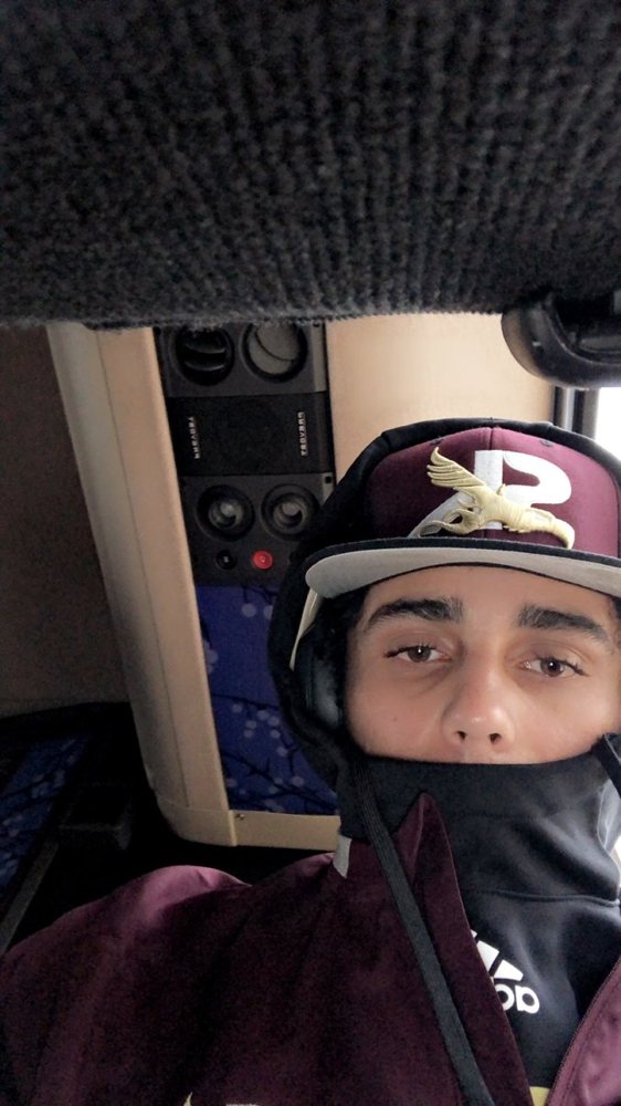 Evan on the team bus in his baseball gear