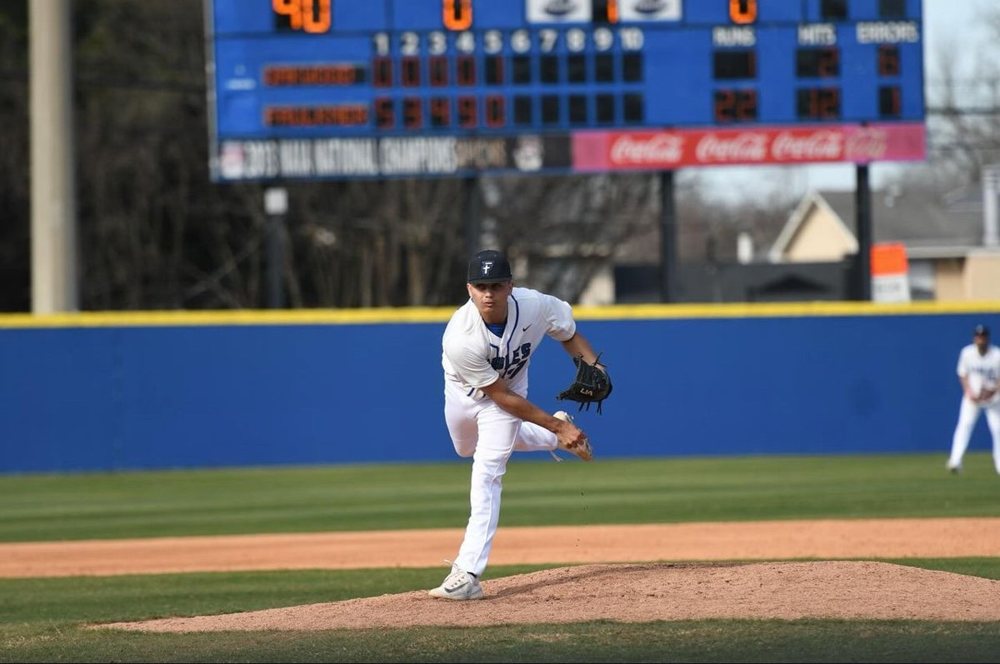 Evan pitching in a college baseball game